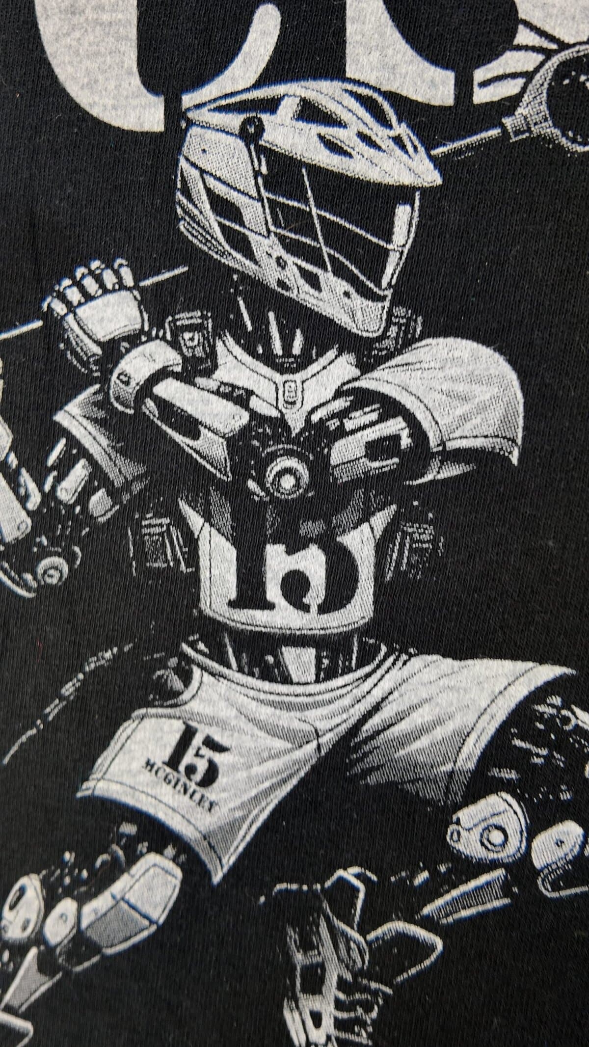 Detailed grayscale halftone screen print of a robot lacrosse player on a black t-shirt by Print Habit