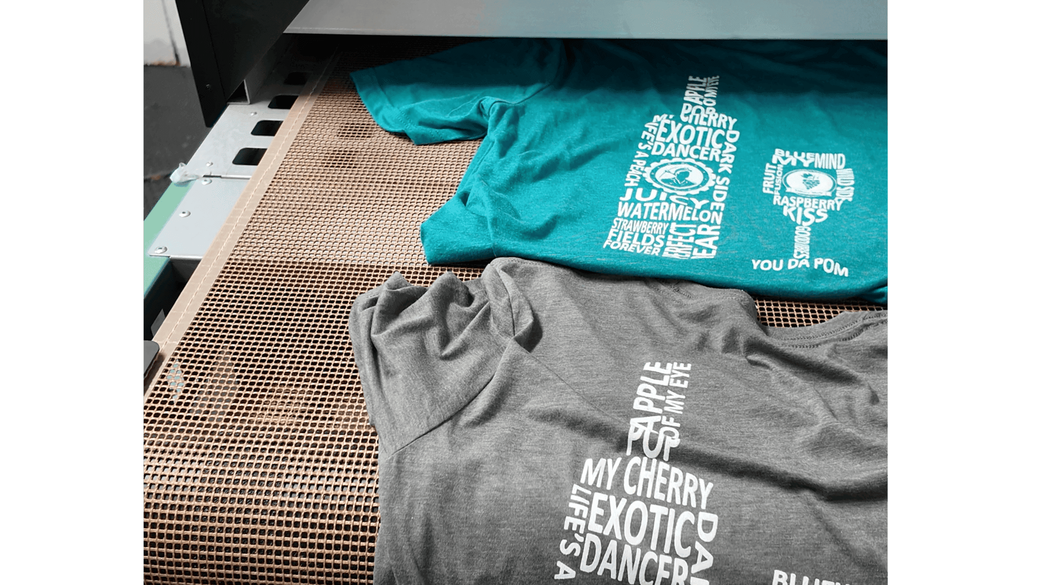 shirts leaving conveyor curing oven