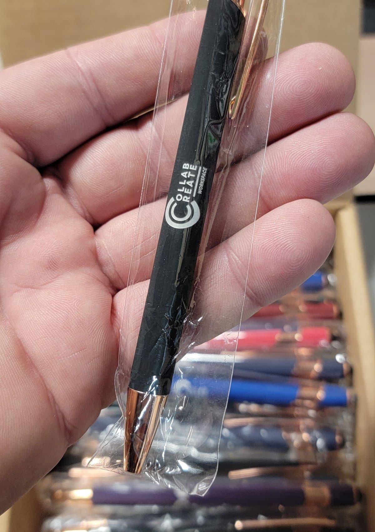 Black soft-touch stylus pen with a custom logo