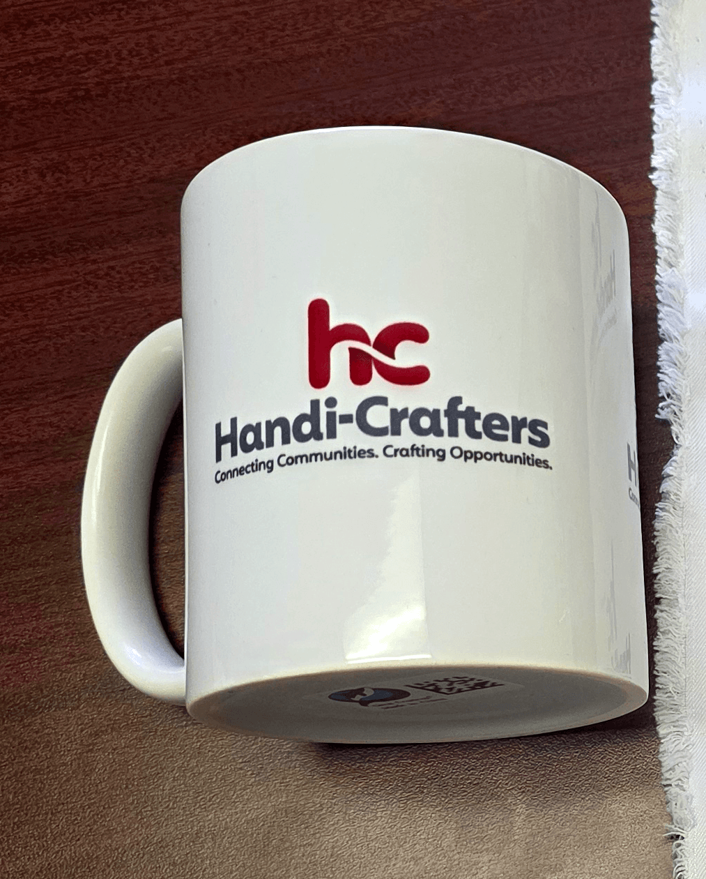 White ceramic mug with a sublimated Handi-Crafters logo — Print Habit, Coatesville PA