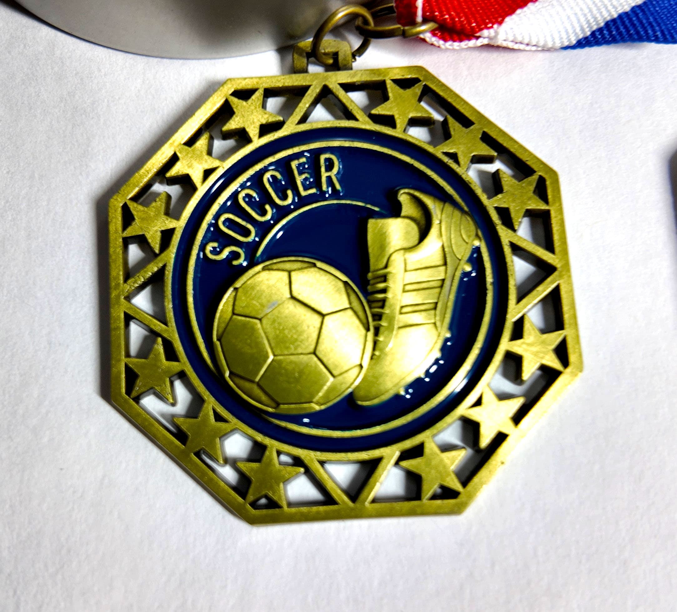 Gold soccer medal with soccer ball and cleat design by Print Habit