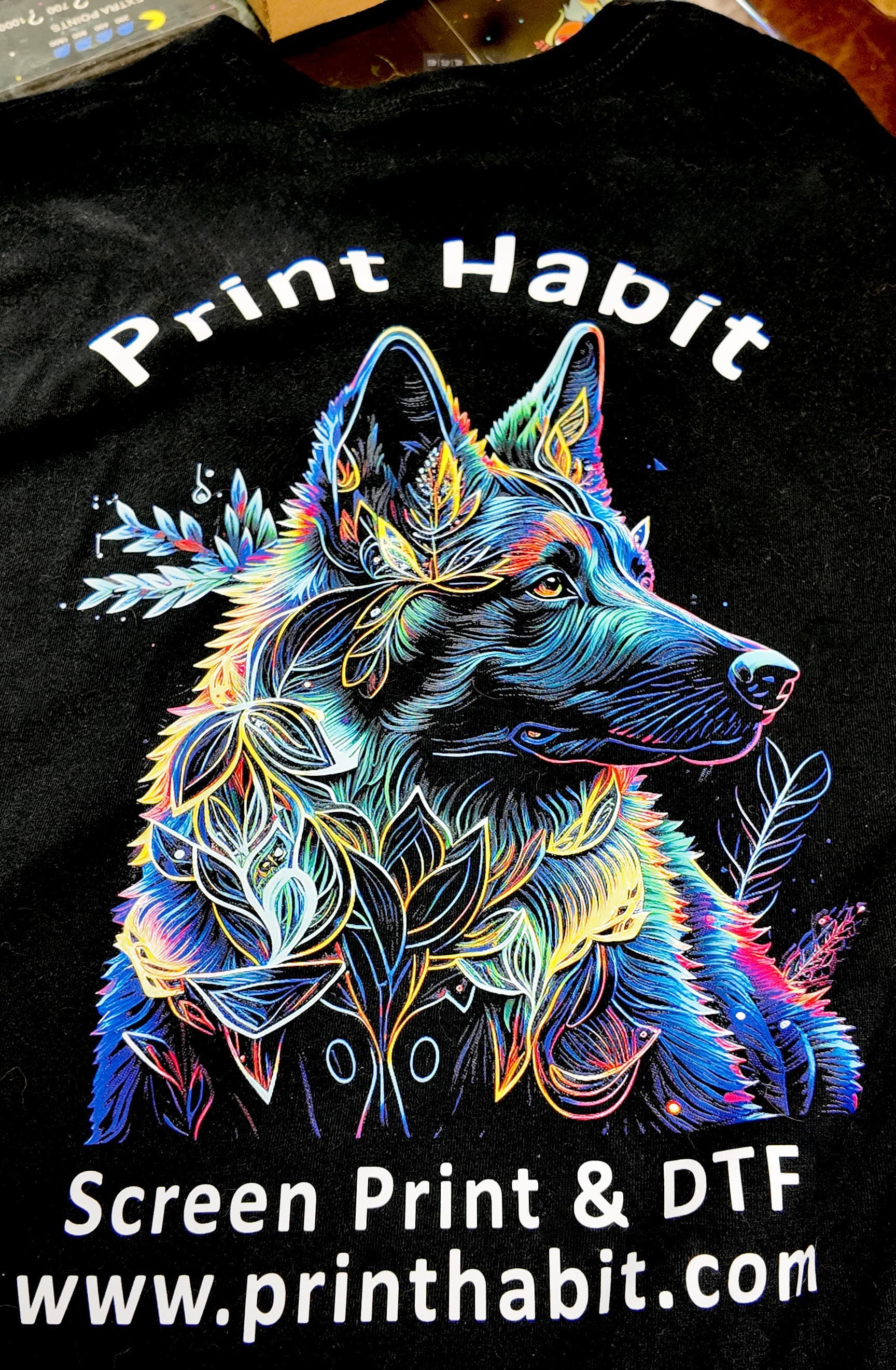 Colorful full-color DTF print of a wolf with floral linework on a black Print Habit t-shirt — Coatesville, PA