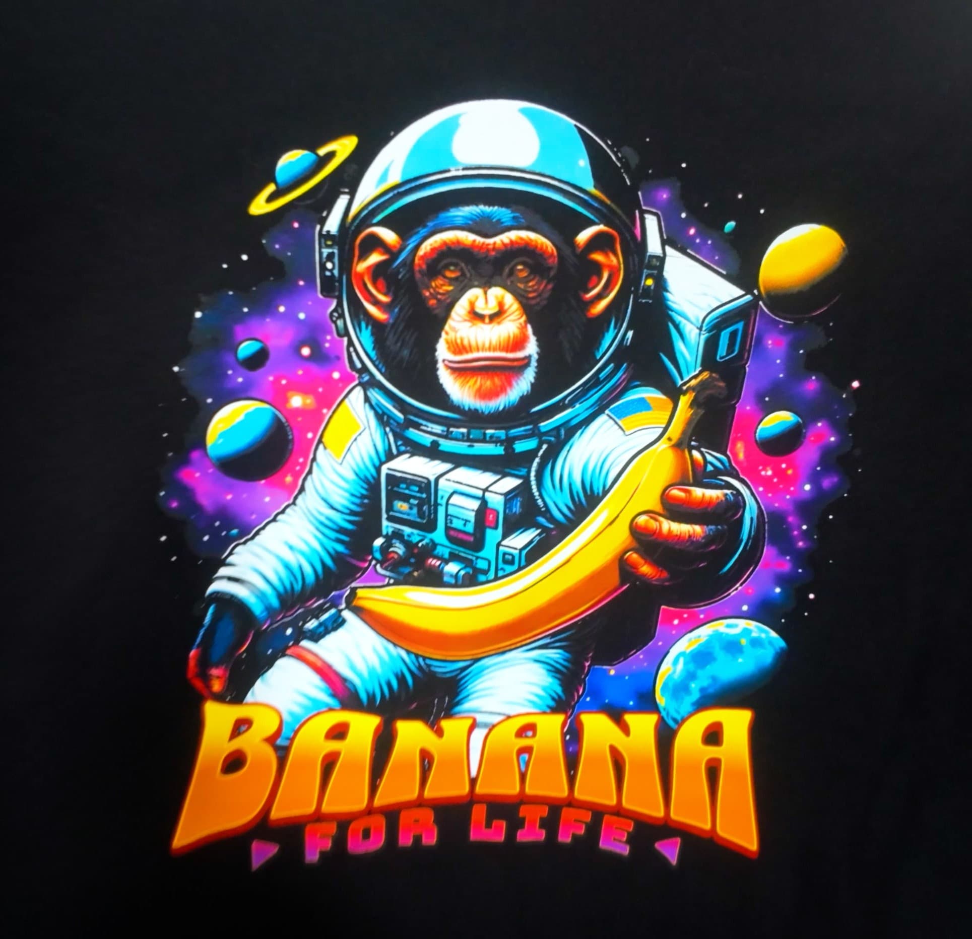 Vibrant full-color DTF astronaut-and-banana print on a black t-shirt — Print Habit, Coatesville PA