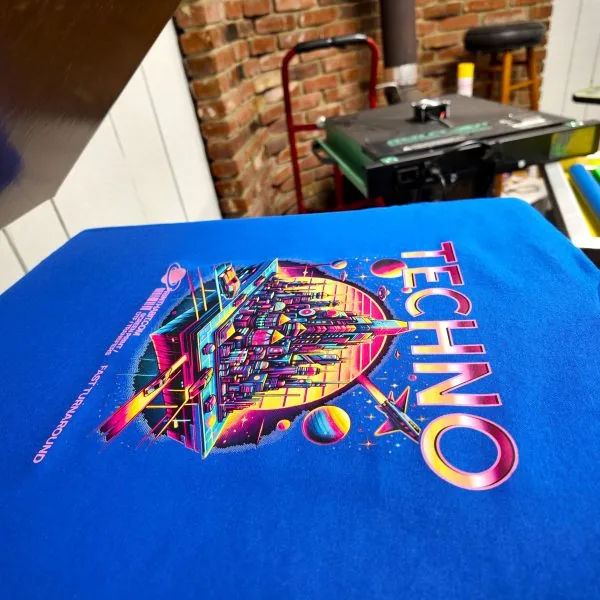 Graphic showing custom dtf printing on t-shirt in heat press