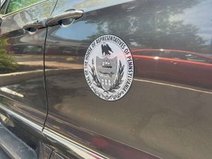 image of stat seal on car door with cling vinyl