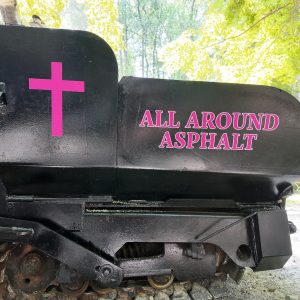 image of custom vehicle lettering n an asphalt machine