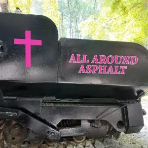 image of custom vehicle lettering n an asphalt machine